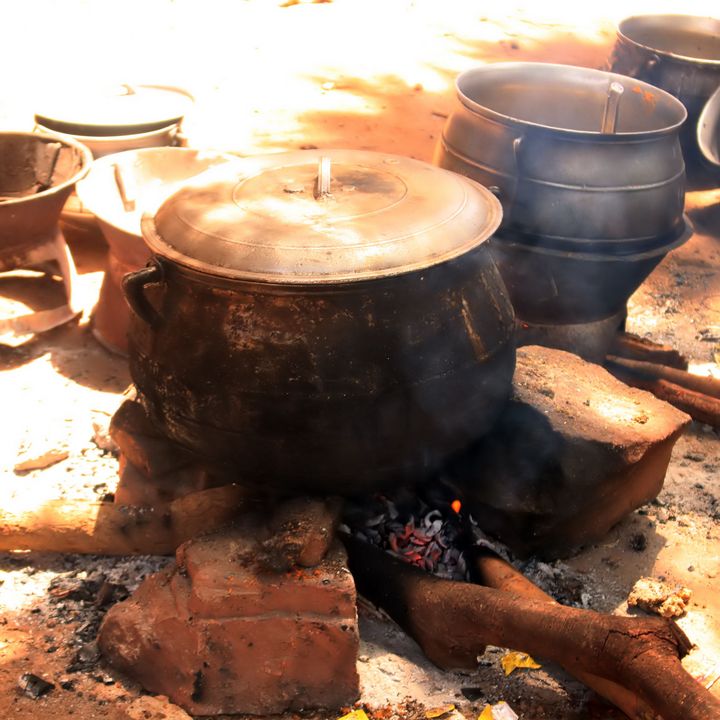 Big pots on a fire place.